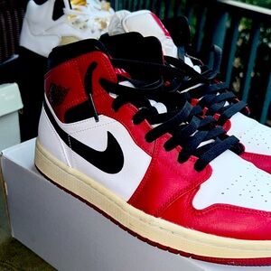 White Red, and black Classic Air Jordans.